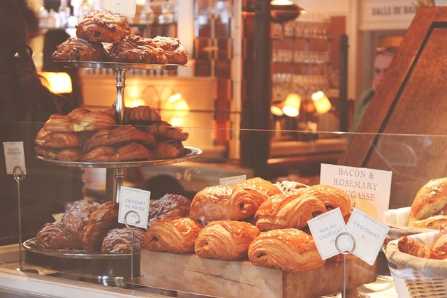 A view of the shop window from outside, looking at all our fresh pastries.